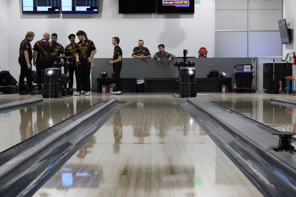 the view of the ASU Bowling team and coaches from the lane