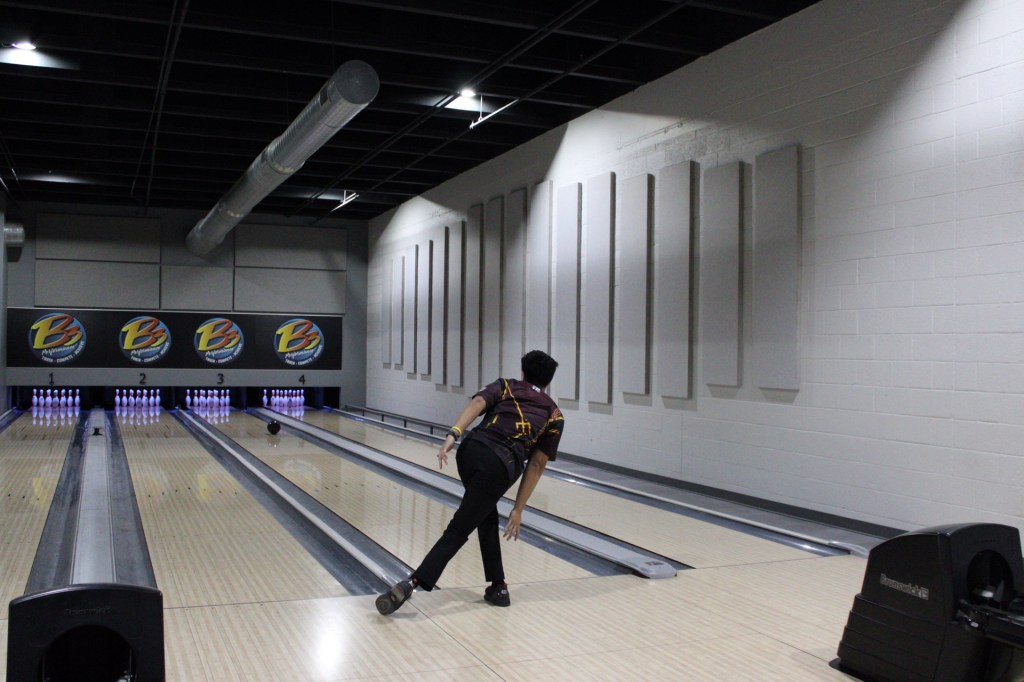 a bowler shown actively bowling