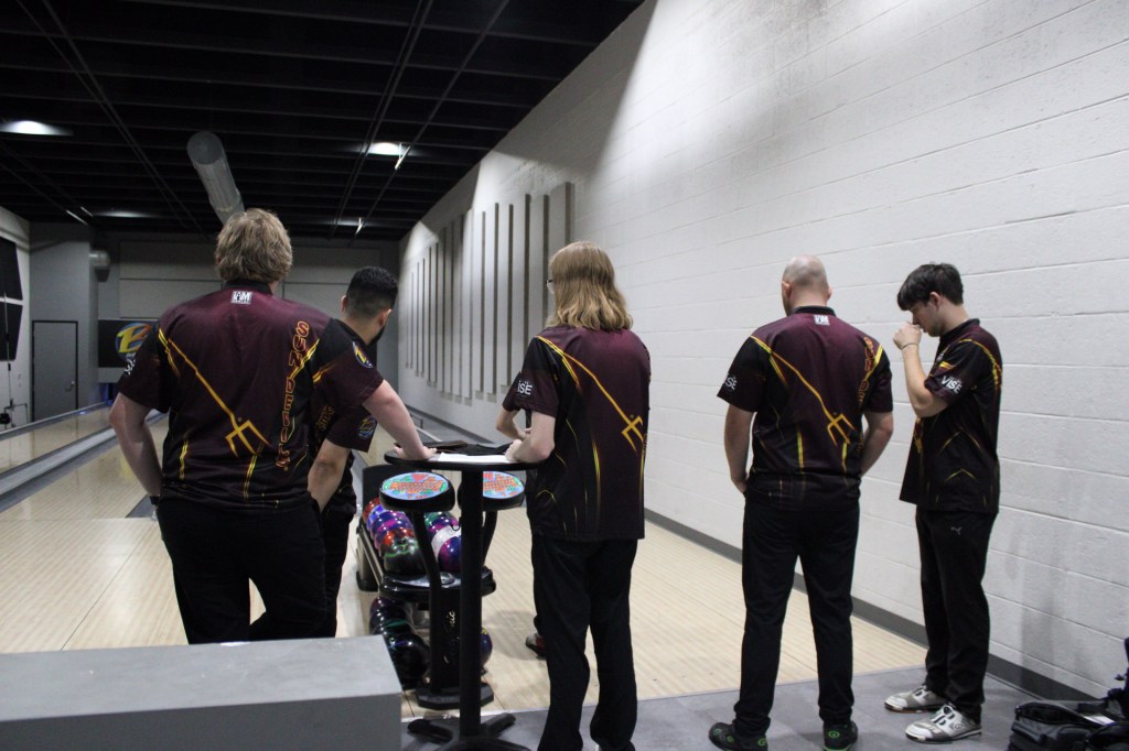 members of the ASU bowling team facing the lanes
